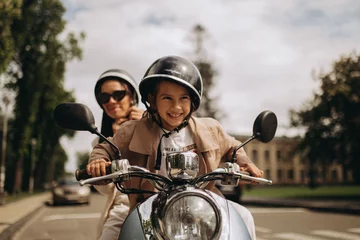 scooter riding mom and daughter in the park © Elizaveta Kovalevska