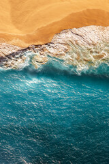 Peaceful bright beach, seaside, vertical view. Drone view of tropical blue ocean beach Nusa penida...