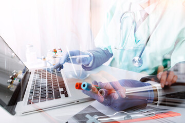 Male doctor sitting at table and writing on a document report in hospital office. Medical healthcare staff and doctor service.