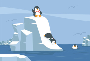 Fototapeta na wymiar Penguins sliding down snowy slope into water