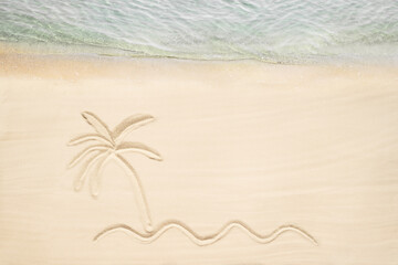 Aerial view of drawing on sand illustrates a relaxing tropical beach scene with sea, a palm tree. Sea coastline. Travel, summer concept. Creative.