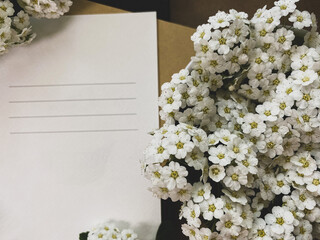 White card and white flowers