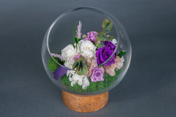 Flower arrangement against a grey backdrop