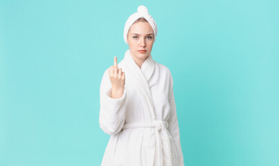 blond pretty woman feeling angry, annoyed, rebellious and aggressive and wearing bathrobe