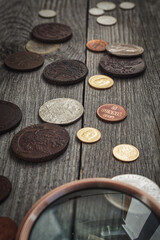 Numismatics. Old collectible coins of silver, gold and copper on the table.