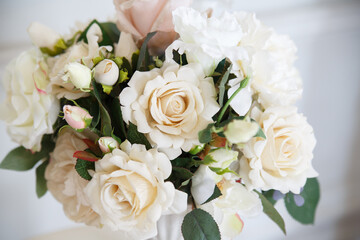 Delicate wedding bouquet of roses.