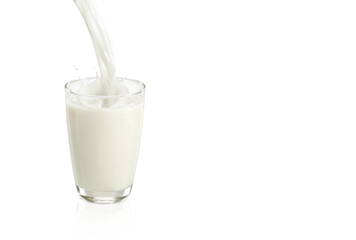 milk pouring into glass isolated on white background - obrazy, fototapety, plakaty