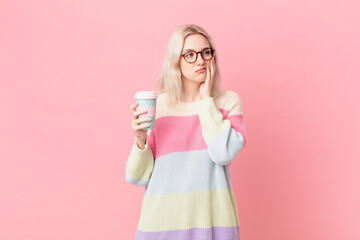 blond pretty woman feeling bored, frustrated and sleepy after a tiresome. coffee concept