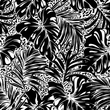 Tropical palm and monstera leaves with leopard skin background abstract vector seamless pattern in black and white