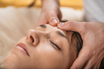 Obraz na płótnie Canvas Thai Facial Rejuvenation Massage Treatment at Wellness Spa Center