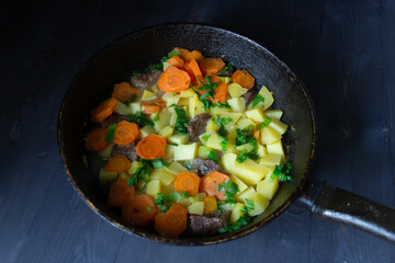 frying pan with vegetables and beeaf