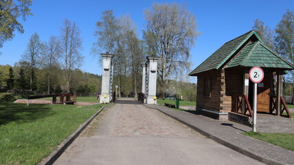 border check point with arch and hut