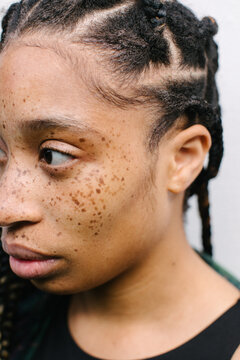 Close up portrait of girl with freckles and braids