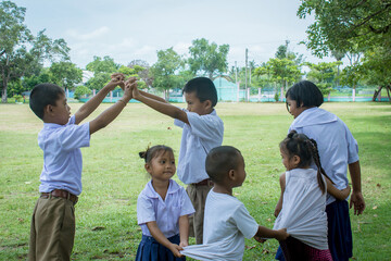 Surin, THAILAND - October 15, 2020:Thai students  are playing traditional Thai game, Catching the last one in the line traditional at a local  school field "Ri Ri Khao San"