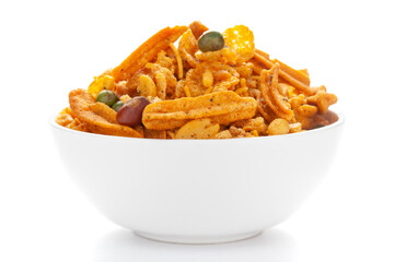 Close up of Teekha Meetha crunchy spicy Indian namkeen (snacks) on a ceramic white bowl. 