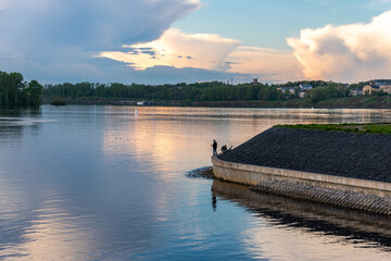 Sunset on the river. Landscape. Fishermans on the coast.