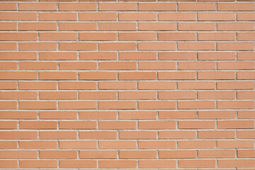 Brick wall with clean orange bricks. Background horizontal texture.