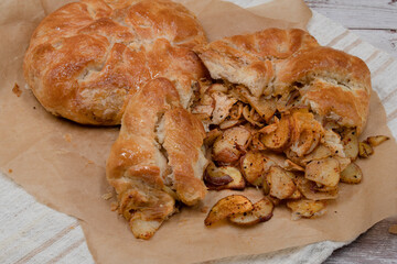 Potato filled pastry- placinte, on brown paper