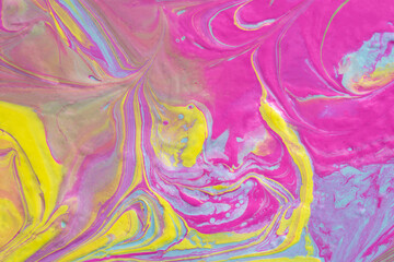 Fototapeta na wymiar Abstract fluid art texture. A multicolored pictorial fragment of a painting. Bright acrylic drawing of pink, yellow, purple, pale green and blue shades close-up. The concept of summer mood, flower
