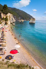 Famous Baia delle Zagare (Zagare Bay) or Baia dei Mergoli (Mergoli Bay) with Faraglioni di Puglia,...