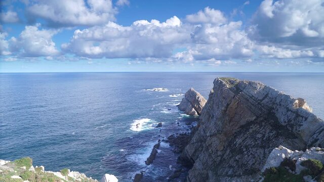 Seascape of Atlantic ocean and Asturias rocky coast at Cape Penas. Sea shore with high cliffs in north Spain.