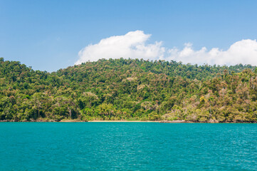 Coastline scenic view with blue sky and sea. Summer vacation day at Paraty's sea.