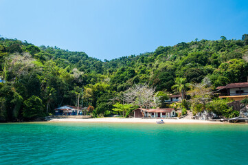 Coastline scenic view with blue sky and sea. Summer vacation day at Paraty's sea.