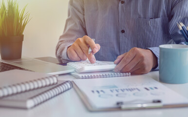 Businessman hands hold documents with financial statistic stock photo,discussion and analysis data the charts and graphs. Finance concept	