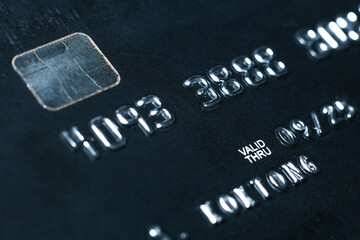 Macro detail of a brand new black and gray luxurious credit card, concept EMV chip card is a...