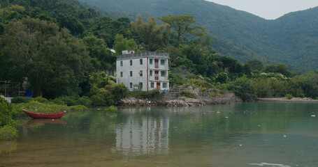 Fototapeta na wymiar Old house on island beside the sea
