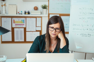 Female professor holding online class for e-learning students during coronavirus pandemic...