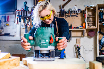 Busy wood designer in a small carpentry workshop