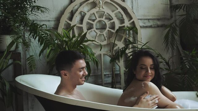 Young couple taking an hot bath in a tropical destination
