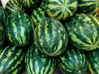 lots of sweet ripe watermelons to eat as a background