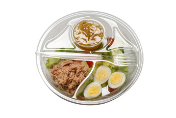 Fresh tuna salad with lettuce, cucombers, cherries and eggs in plastic container.