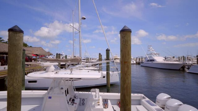 Panning shot boats at marina Coconut Grove Miami FL