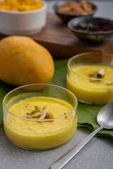 mango-flavored Phirni served in  glass bowls