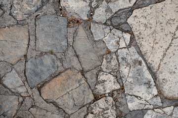 Fototapeta premium top view of the floor surface of cracked pieces of marble