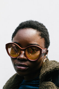 Portrait of a young woman with afro and sunglasses