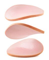Pieces of boiled sausage are flying on a white. Isolated