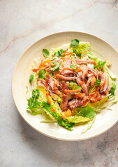 Duck salad with cabbage and peanut butter sauce