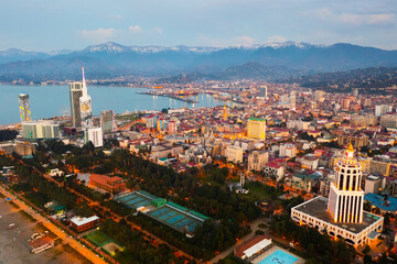 Obraz premium Scenic cityscape of town Batumi with illuminated Alphabetic Tower at spring evening, Georgia