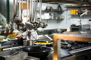 Detail of the interior of a restaurant kitchen at work.