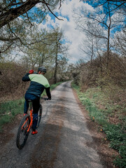 Fototapeta premium Man ride mountain bike in spring forest path. CrossCountry cycling.