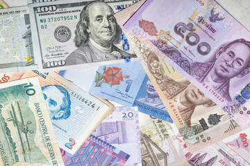 Fototapeta na wymiar Heap of different foreign currency banknotes for travel in many countries (USD, Euro, Southeast Asia cash collection). International money investment, global financial trade market. World economic