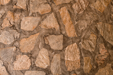 fragment of cladding wall with natural stone of various shapes
