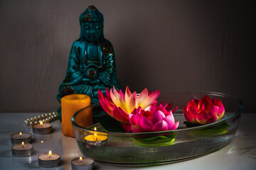 Aromatic bowl with candles and flowers