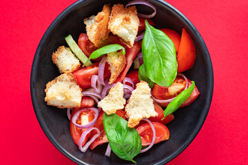 tomato salad panzanella veggie croutons, onion, olive oil, rusk on the table healthy food meal snack copy space food background rustic. top view vegan vegetarian food