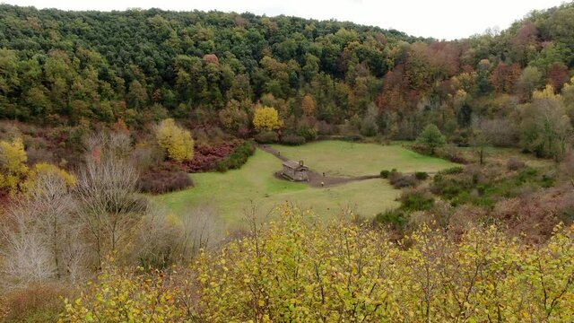 The Santa Margarida volcano with a hermitage in the centre of its crater. La Garrotxa Volcanic Zone Natural Park is a curious environment that overlooks part of the province of Girona.