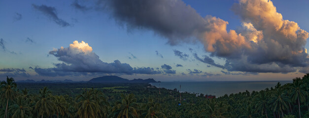 Tranquil fluffy cloud over the tropical mountain at sunrise in Thailand